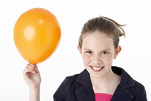 Young Girl Holding Party Balloon