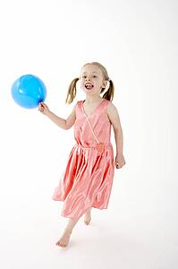 Young Girl Holding Party Balloon