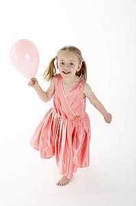 Young Girl Holding Party Balloon