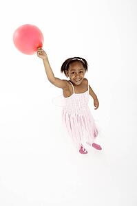 Young Girl Holding Party Balloon