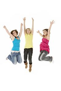 Group Of Three Young Girls Leaping In Air