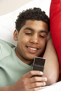 Young Boy Reading Text Message