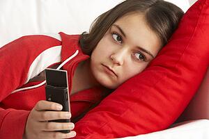 Young Girl Waiting For Phone Call