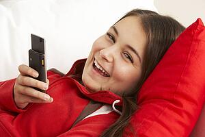 Young Girl Reading Text Message