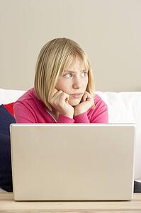 Worried Looking Girl Using Laptop