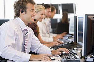 Stock Traders Working At Computers