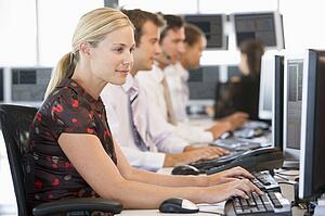 Stock Traders Working At Computers