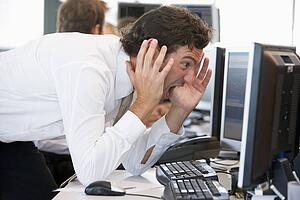 Businessman Looking Shocked At Monitor