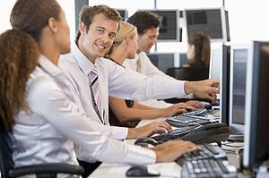 Stock Traders Working At Computers