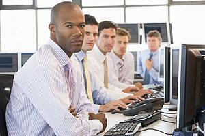 Team Of Stock Traders At Computers
