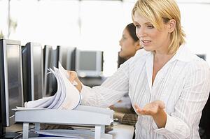 Stock Trader Going Through Paperwork