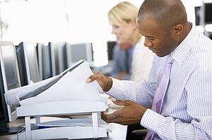 Stock Trader Looking Though Paperwork