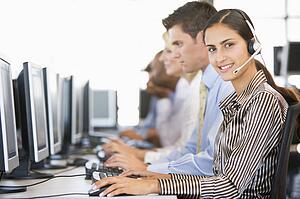 Stock Traders With Headsets At Work
