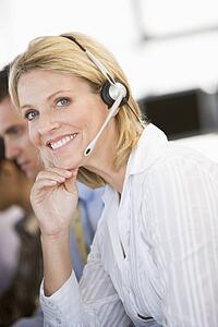 Stock Traders With Headsets At Work