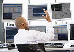 Stock Trader Talking Animatedly On The Phone