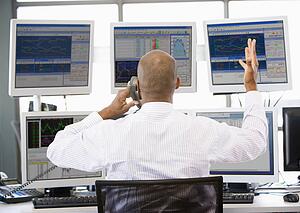 Stock Trader Talking Animatedly On The Phone