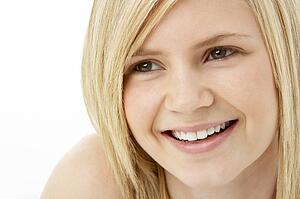 Studio Portrait Of Smiling Teenage Girl