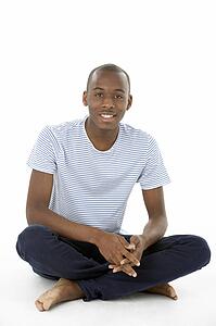 Teenage Boy Sitting In Studio