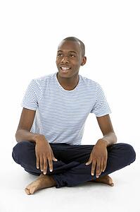 Teenage Boy Sitting In Studio