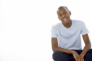 Teenage Boy Sitting In Studio