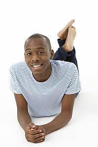 Teenage Boy Laying On Stomach