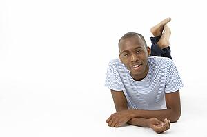 Teenage Boy Laying On Stomach