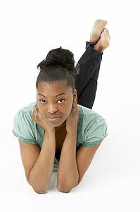 Teenage Girl Laying On Stomach