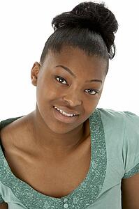 Studio Portrait Of Smiling Teenage Girl