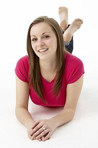 Teenage Girl Laying On Stomach