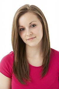 Studio Portrait Of Smiling Teenage Girl
