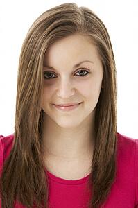 Studio Portrait Of Smiling Teenage Girl