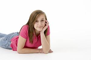 Teenage Girl Laying On Stomach