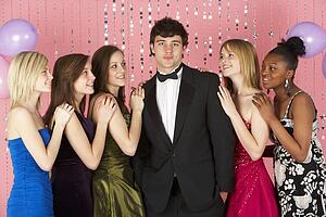 Teenage Girls Looking At Attractive Boy
