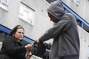 Man Mugging Woman In Street