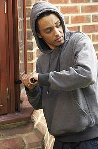 Young Man Breaking Into House