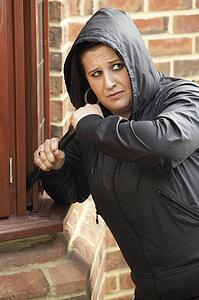 Young Woman Breaking Into House