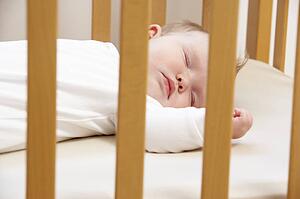 Newborn Baby In Cot