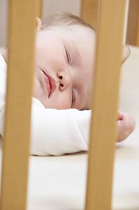 Newborn Baby In Cot