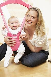Baby In Bouncer With Mother