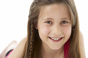 Studio Portrait of Smiling Girl