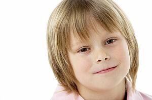 Studio Portrait of Smiling Boy