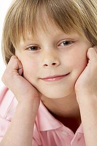 Studio Portrait of Smiling Boy