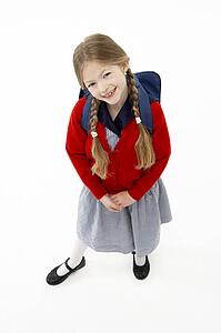 Studio Portrait of Smiling Girl Wearing School Bag