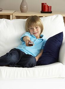 Young Boy Watching Television at Home
