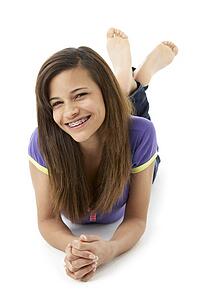 Teenage Girl Laying on Stomach