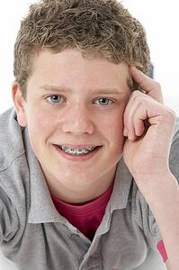 Studio Portrait of Smiling Teenage Boy