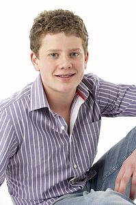 Studio Portrait of Smiling Teenage Boy