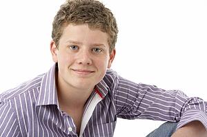 Studio Portrait of Smiling Teenage Boy