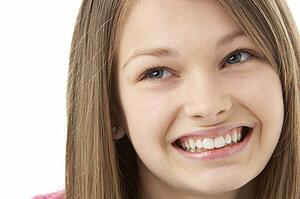 Studio Portrait of Smiling Teenage Girl