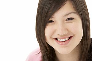 Studio Portrait of Smiling Teenage Girl